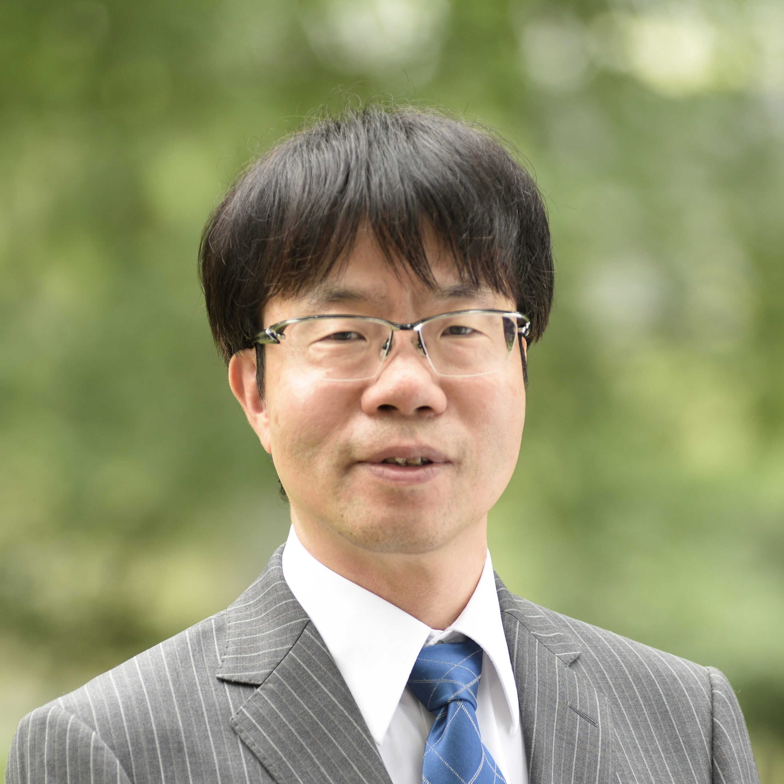 油納　健一